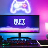 Metaverse and Blockchain Technology Concept – Gaming room displaying NFT marketplace on computer screen – Focus on monitor
